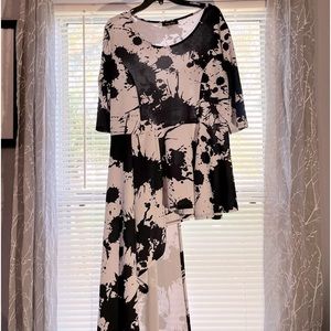 Plus-size women’s peplum black and white elegant top.